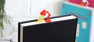 Illustration for article titled Adorable Desk Lamp Bookmark Sheds Light On the Last Page You Read